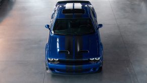 An overhead view of a blue-with-black-stripes 2022 Dodge Challenger SRT Hellcat Widebody