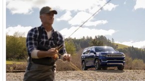 A man stands in front of a 2022 Jeep Grand Wagoneer.