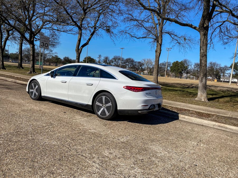 The side 3/4 view of a white 2022 Mercedes-Benz EQS 450+ on a street