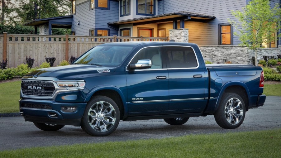 Blue 2022 Ram 1500 Limited in front of a house