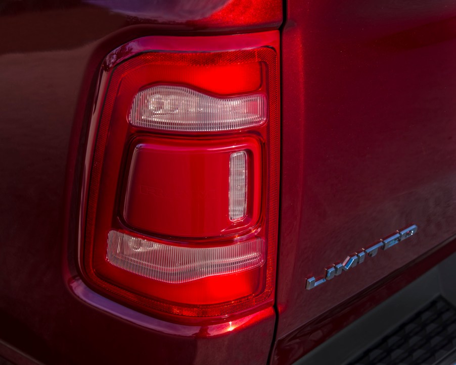 Detail shot of the taillight of a red 2022 pickup truck.