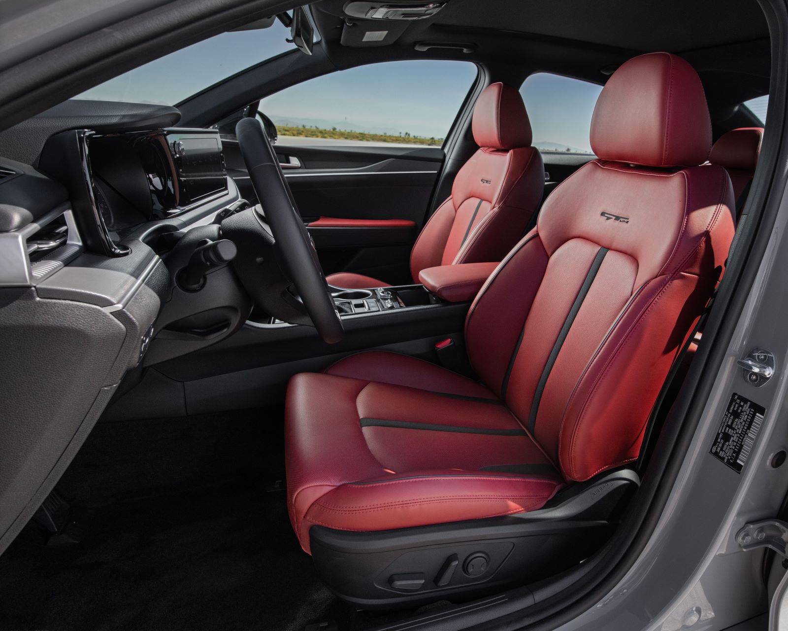 Interior of the 2022 Kia K5 GT-Line with red faux leather seats