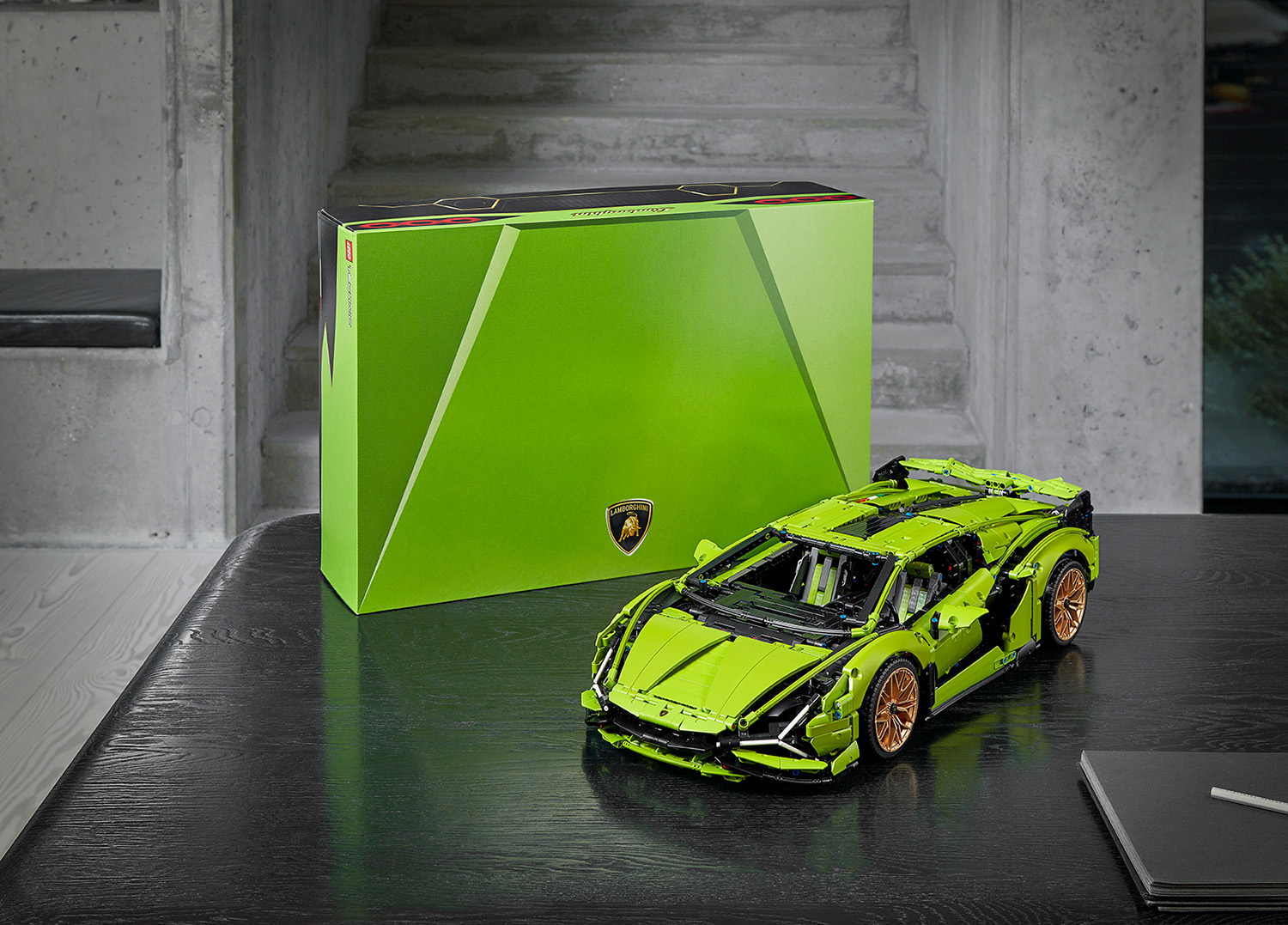 Lamborghini Sian Lego Technic green model on table displayed with its box