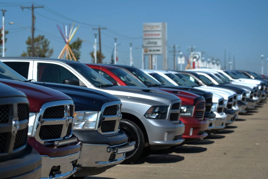 A lineup of Ram trucks at a CDJR car sales dealership