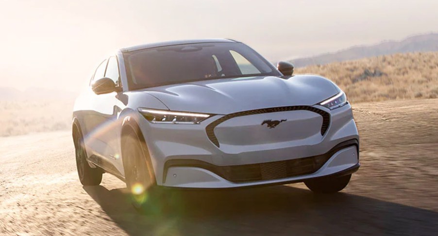 A white Ford Mustang Mach-E electric SUV.