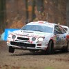 Toyota Celica Rally car sliding sideways around a corner in the dirt