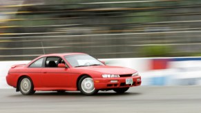 Josh Hebert drifts his 1997 Nissan 240SX through a turn on Beech Ridge Speedway's rain-slicked track