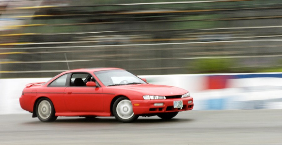 Josh Hebert drifts his 1997 Nissan 240SX through a turn on Beech Ridge Speedway's rain-slicked track