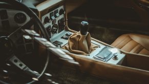 Clean car interior with vintage leather seats.