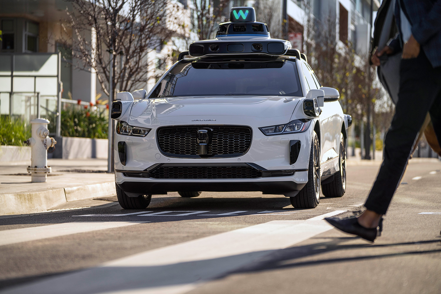 Waymo autonomous self-driving Jaguar I-Pace Electric AV parked on curb in San Fransisco