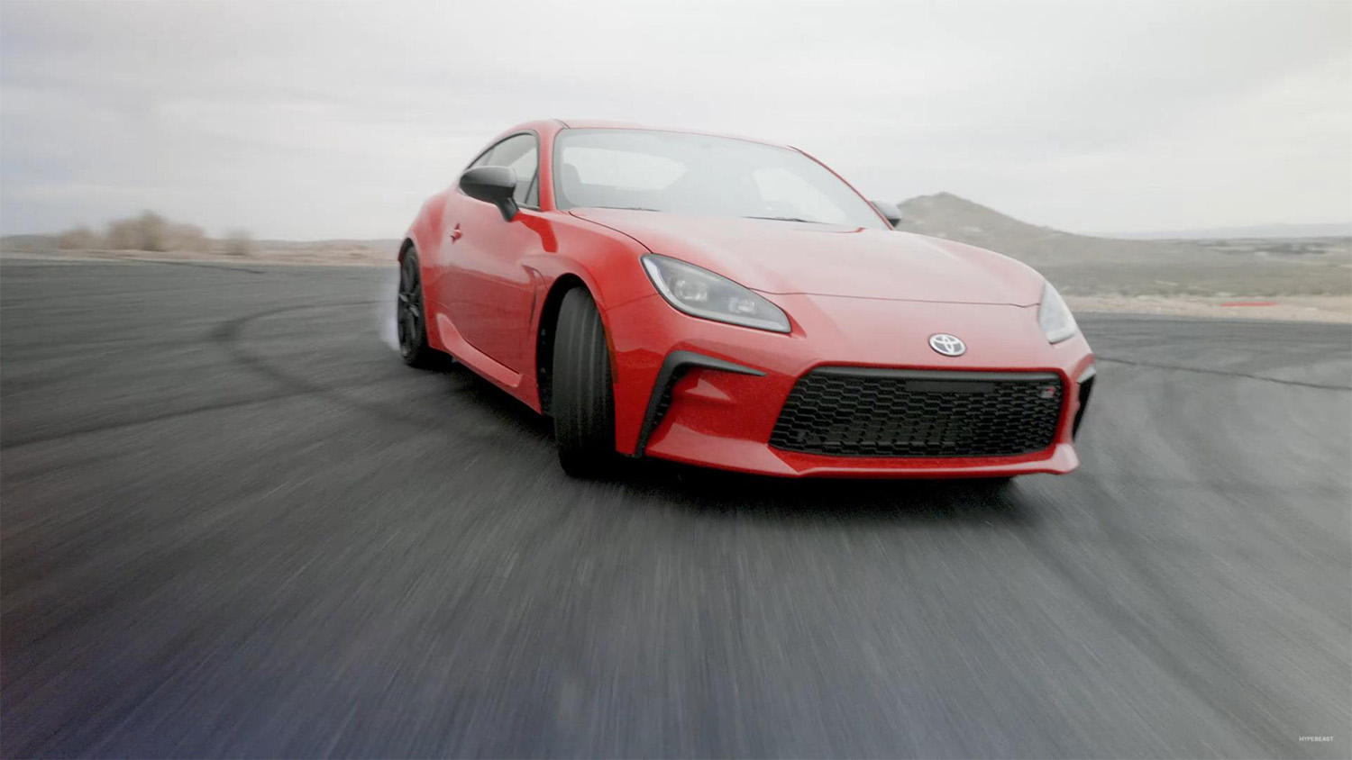 Jhonnattan Castro driving his 2022 Toyota GR86 on track, driifting Willow Springs raceway