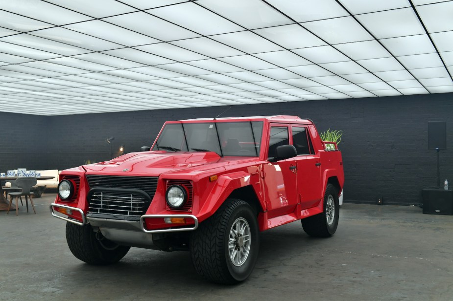 The ultra rare red Lamborghini LM002 Italian SUV at a press event.