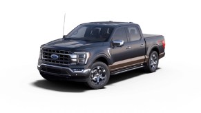 A dark blue 2022 Ford F-150 Lariat against a white background.