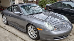 Silver 2001 Porsche 991 911 Carrera base with six-speed manual transmission, sport package, and technic package