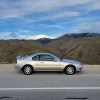 Silver 1996 Honda Prelude Si parked on mountain road with valley in background, passenger side