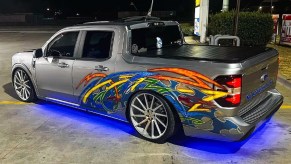 Rear angle view of custom Ford Maverick with graffiti-style paint, showing ways owners modify the pickup truck