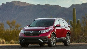 Red 2022 Honda CR-V Hybrid with a desert landscape in the background