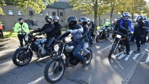 Gear-clad riders and passengers on motorcycles take part in a 'ride of respect' in the UK