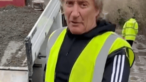 Rod stewart fixing a pothole