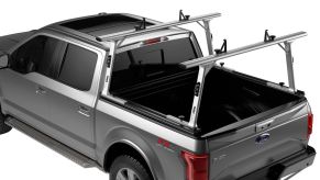 Promo photo of an aluminum ladder rack on a gray Ford F-150 pickup truck.