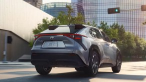 The back of a silver 2023 Toyota bZ4X electric SUV.