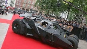 Movie prop Batmobile Tumbler driving the red carpet at the UK premier of Batman Begins.