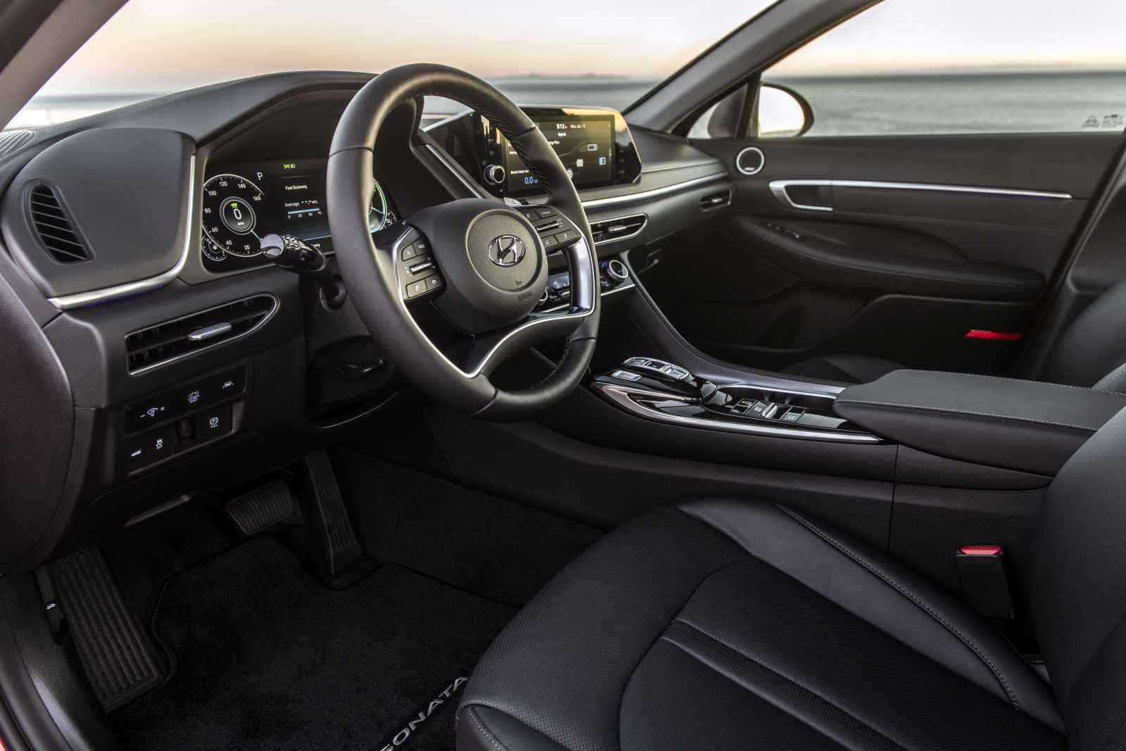 Interior shot of a 2022 Hyundai Sonata Hybrid, a great rideshare car, with a black interior