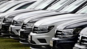 Line of cars at a dealership. These cars may have open recalls and still be sold