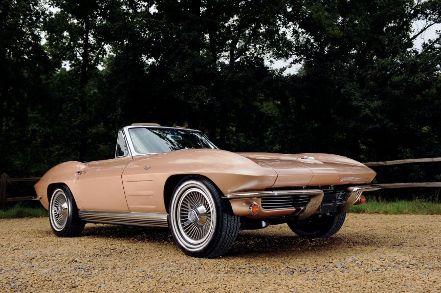 1964 Chevrolet Corvette Stingray convertible model parked on a gravel forest path