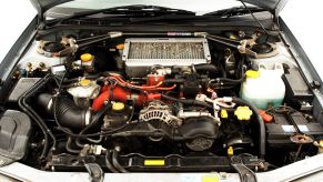 2000 Subaru Impreza boxer/flat-four engine and other auto parts under the hood