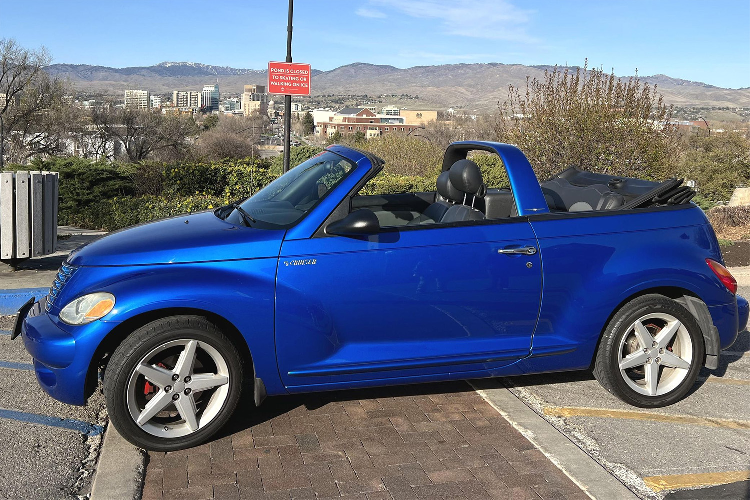 Electric Blue Chrysler PT Cruiser GT Covnertible, Driver's side with top down