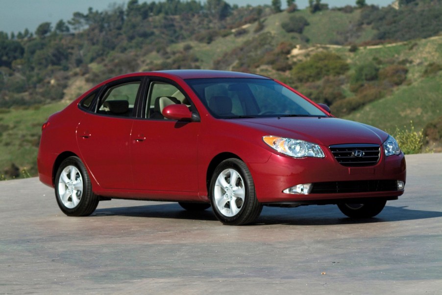 Front 3/4 of red 2009 Hyundai Elantra in mountain setting