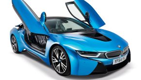 A blue 2015 BMW i8 with its gullwing doors up