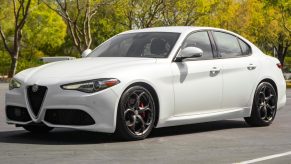 A white 2018 Alfa Romeo Giulia Q2 Ti Sport in a parking lot