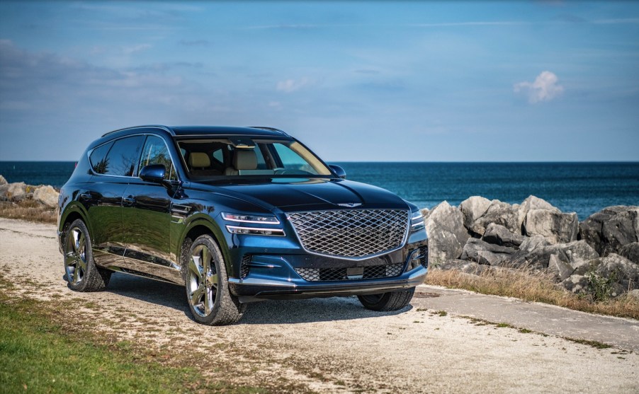 Promo shot of a Hyundai GV80 crossover SUV parked by the water.