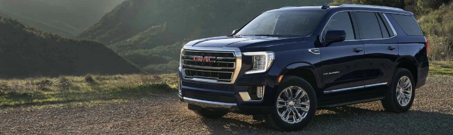 A black 2022 GMC Yukon XL on a mountain top.