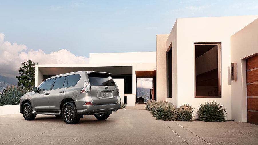 A beige 2022 Lexus GX 460 outside of a house.