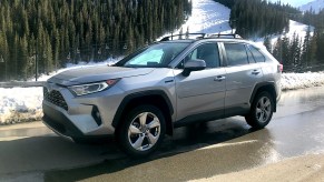 2022 Toyota RAV4 hybrid side view by a snow mountain