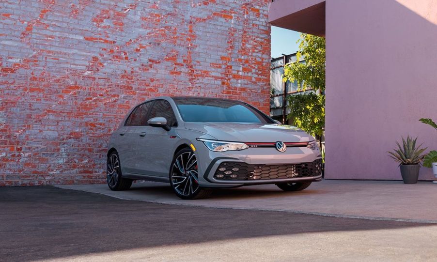 2022 Volkswagen Golf GTI Autobahn parked in front of a worn brick wall