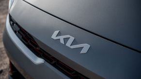 Close up view of the redesigned Kia brand logo on the front end of the 2022 Kia Forte FE base model