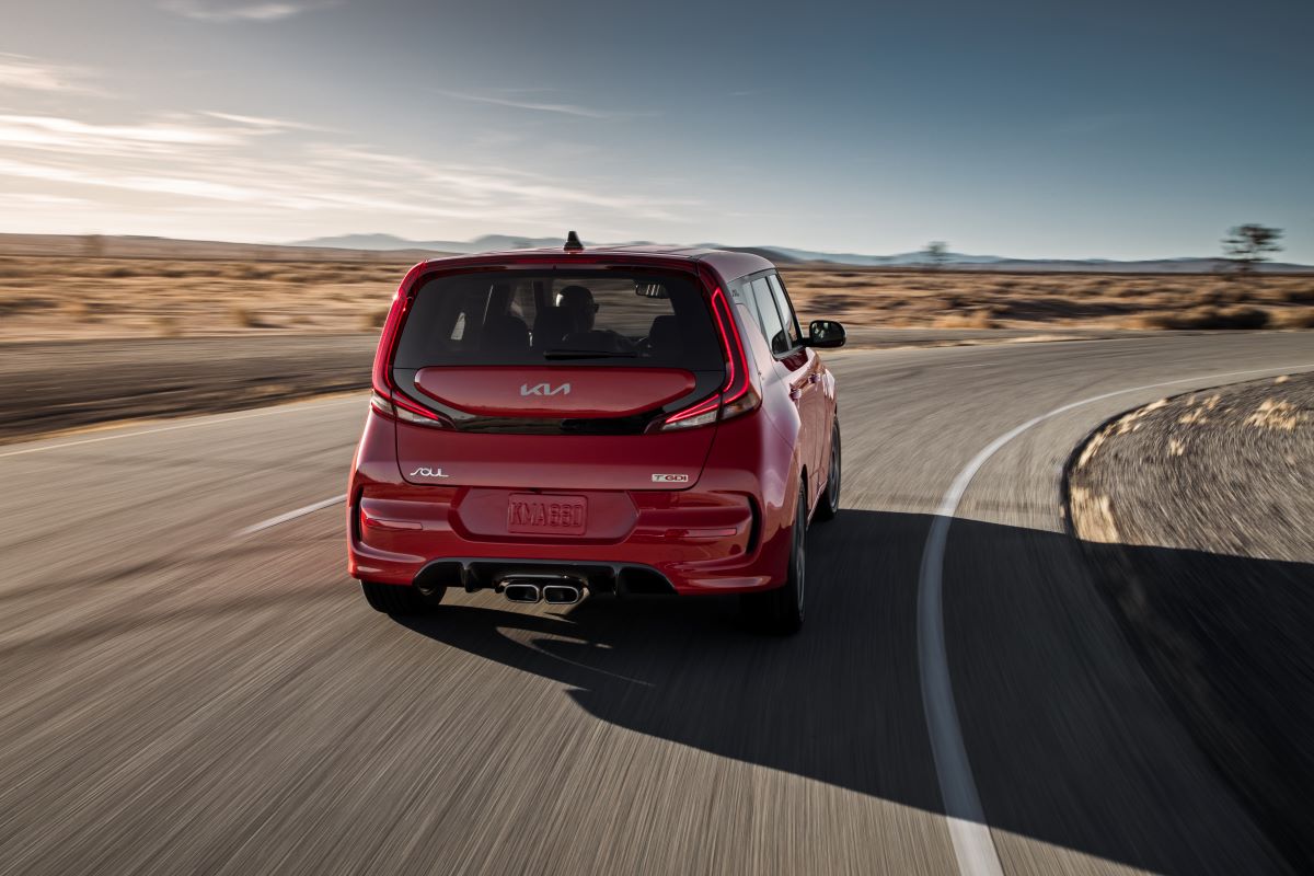 Rear view of a red 2022 Kia Soul hatchback, one of the best rental cars