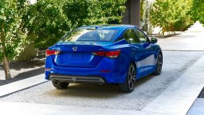 Rear angle view of a blue 2022 Nissan Sentra S base model compact sedan