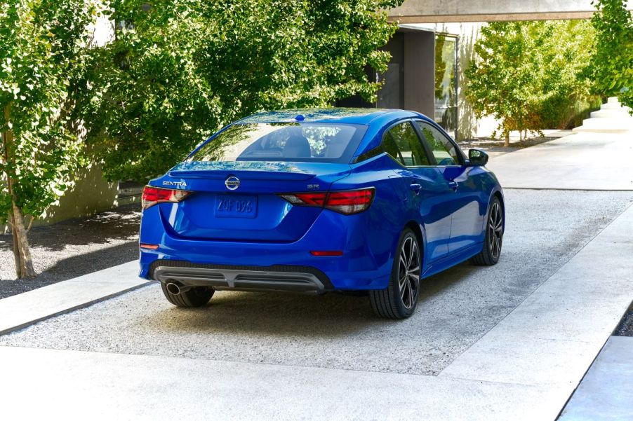 Rear angle view of a blue 2022 Nissan Sentra S base model compact sedan