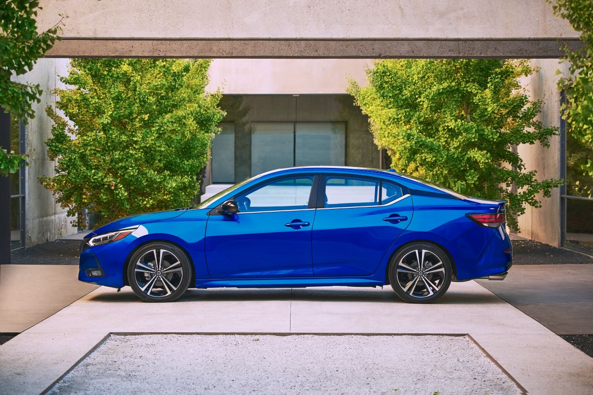 Side view of a blue 2022 Nissan Sentra S base model compact sedan