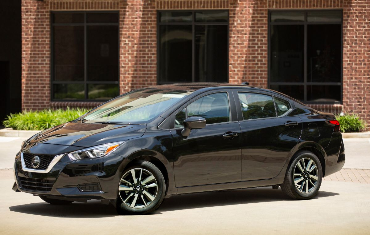 Side angle view of a black 2022 Nissan Versa sedan, the cheapest and one of the best new cars under $20,000