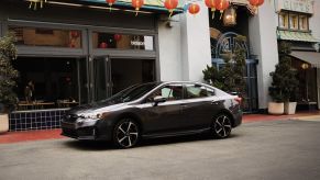 Side view of a black 2022 Subaru Impreza, one of the best and most reliable new cars under $20,000