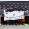 Rick Hendrick, with his grandson, Barrett-Jackson chairman and CEO Craig Jackson, Thurgood Marshall College Fund representatives and the 2023 Corvette Z06 convertible.