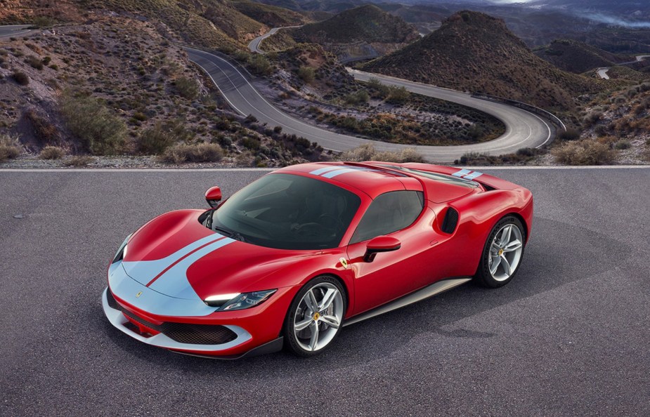 A 2023 Ferrari 296 GTS with Assetto Fiorano package and red-and-white 250 Le Mans livery parked roof up in the desert canyons