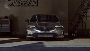 Dimly lit shot of a 2023 Acura Integra, cost unknown, parked in a garage