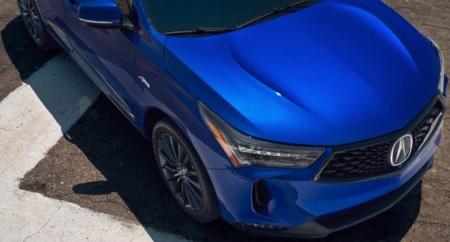 A blue 2022 Acura RDX small SUV is parked.